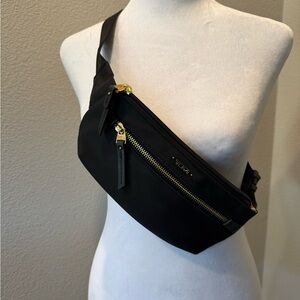 Tumi Black Crossbody Belt Bag with Gold Hardware Accents